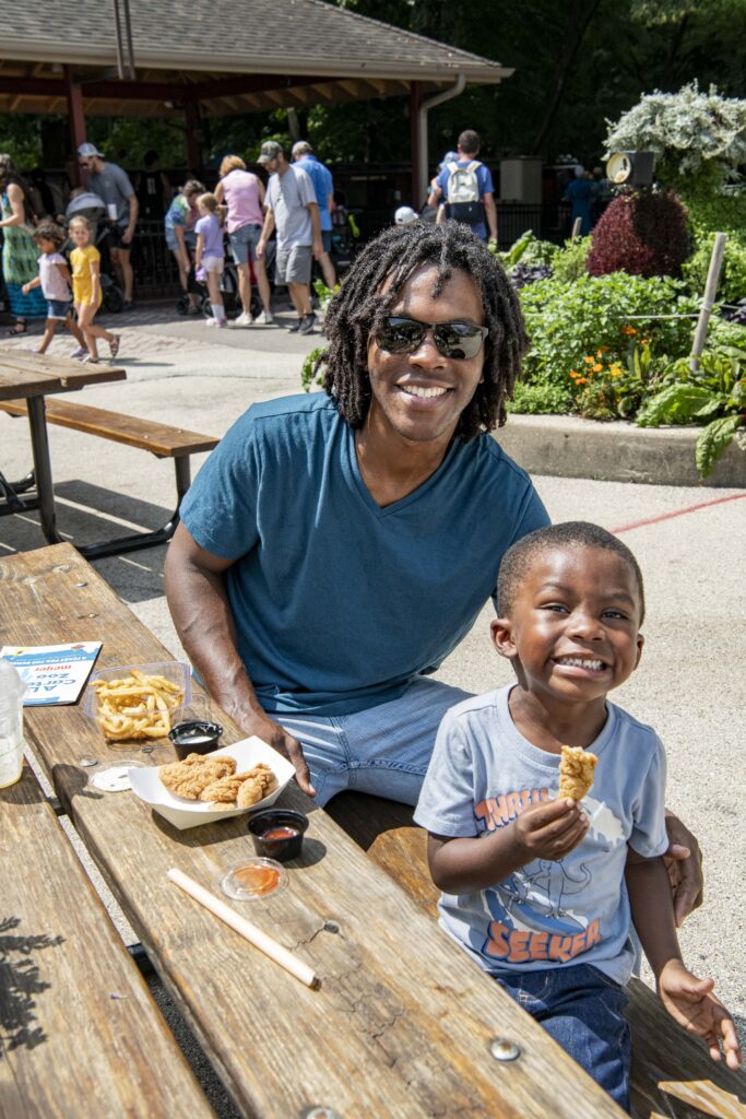Father and son eating a snack at A La Carte