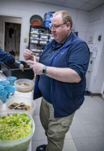 Zookeeper in a kitchen prepping food