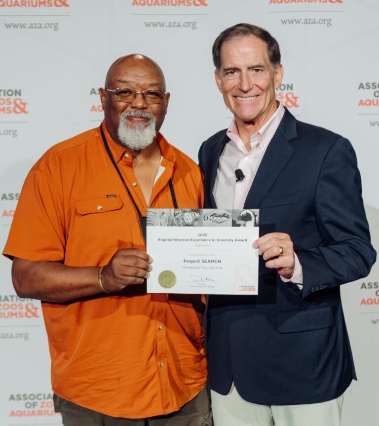 Zoo Director Amos Morris accepts the award